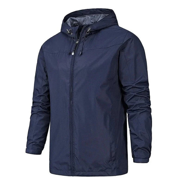 Chaqueta cortavientos deportiva para hombre.
Capucha con cordón ajustable, bolsillos para las manos con cremallera, azul oscuro.